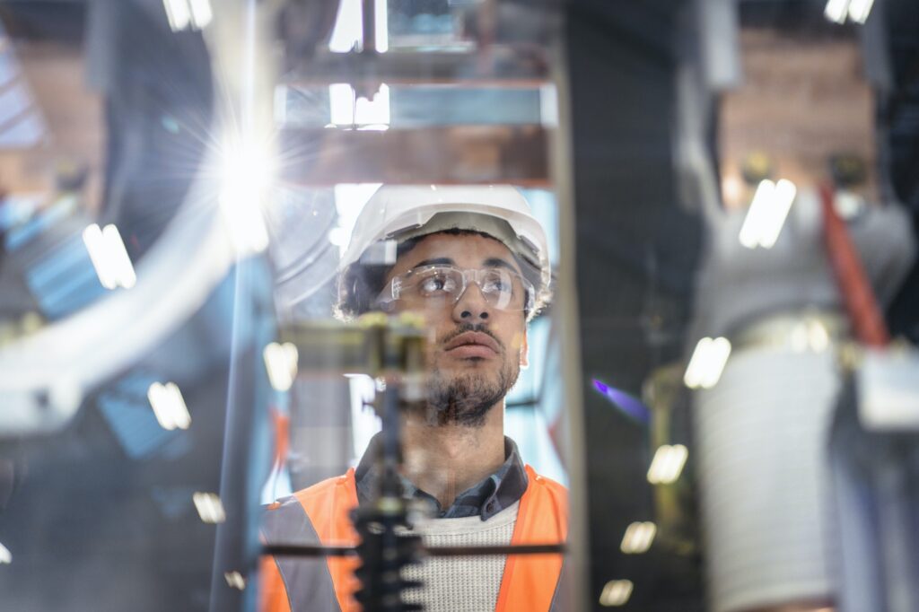 Portrait of apprentice in workshop of railway engineering facility